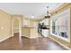 Inviting living room showcasing an eat-in kitchen, laminate flooring and natural light at 4155 Guilford Nw Ct, Concord, NC 28027