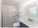 Bathroom featuring new tiled shower with glass door at 4313 Sudbury Rd, Charlotte, NC 28205