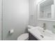 Bright bathroom with a white vanity, brushed nickel fixtures, and tiled shower with a glass door at 4313 Sudbury Rd, Charlotte, NC 28205