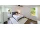 Bright bedroom features two windows, hardwood floors and a ceiling fan at 4313 Sudbury Rd, Charlotte, NC 28205