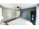 A comfortable bedroom featuring hardwood floors and a built-in bookshelf at 4313 Sudbury Rd, Charlotte, NC 28205