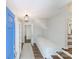 Bright and inviting foyer with light gray walls, a blue front door, and warm wood flooring at 4313 Sudbury Rd, Charlotte, NC 28205
