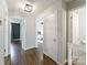Hallway with hardwood floors leads to bedrooms and bathrooms at 4313 Sudbury Rd, Charlotte, NC 28205
