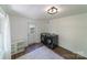 Convenient laundry room with modern washer and dryer and storage shelving at 4313 Sudbury Rd, Charlotte, NC 28205