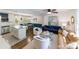 Open-concept living room flowing into the kitchen, with stylish seating, modern decor, and abundant light at 4313 Sudbury Rd, Charlotte, NC 28205