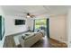Cozy living room with sliding glass doors that lead to the backyard at 4313 Sudbury Rd, Charlotte, NC 28205