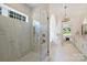 Bright bathroom featuring a glass shower, a soaking tub, and modern fixtures at 5010 Ohm Ln, Charlotte, NC 28270