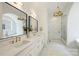 Luxurious bathroom boasts double sinks, modern fixtures, and stylish mirrors at 5010 Ohm Ln, Charlotte, NC 28270
