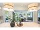 Kitchen island with marble countertop and seating, with a view to the dining and living areas at 5010 Ohm Ln, Charlotte, NC 28270