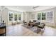 Bright living room boasts ample natural light, hardwood floors and modern decor at 5010 Ohm Ln, Charlotte, NC 28270