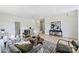 Living room with modern furnishings and decor, featuring hardwood floors and ample lighting at 5010 Ohm Ln, Charlotte, NC 28270
