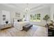Bright and airy main bedroom boasts natural light, hardwood floors, and ample space at 5010 Ohm Ln, Charlotte, NC 28270