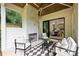 Outdoor patio area featuring a fireplace and comfortable seating with a view to the interior at 5010 Ohm Ln, Charlotte, NC 28270