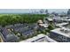 An aerial view of townhomes with a stunning skyline backdrop in a vibrant cityscape at 510 Music Hall Way, Charlotte, NC 28203