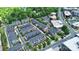 Aerial view showcases a neighborhood of townhomes, with tree-lined streets and beautiful landscaping at 510 Music Hall Way, Charlotte, NC 28203