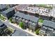 Aerial view of new construction townhomes, showcasing rooftop patios and modern exteriors, in a developing urban area at 510 Music Hall Way, Charlotte, NC 28203