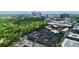 Aerial view of modern townhomes, construction site, and city skyline, emphasizing urban development and community growth at 510 Music Hall Way, Charlotte, NC 28203