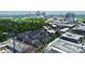 Aerial view of modern townhomes, construction site, and the city skyline, emphasizing urban development and community growth at 510 Music Hall Way, Charlotte, NC 28203