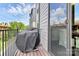 View of the grill covered on the wood floor on the balcony at 510 Music Hall Way, Charlotte, NC 28203