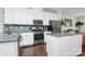Well-equipped kitchen with white cabinets, stainless steel appliances, and granite countertops at 510 Music Hall Way, Charlotte, NC 28203