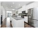 Bright, modern kitchen with white cabinets, stainless steel appliances, and granite countertops at 510 Music Hall Way, Charlotte, NC 28203