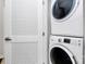 Convenient laundry area featuring a stacked washer and dryer unit, maximizing space and efficiency at 510 Music Hall Way, Charlotte, NC 28203