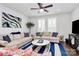 Stylish living room featuring neutral walls, hardwood floors, comfortable seating, and a striped rug at 510 Music Hall Way, Charlotte, NC 28203
