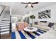 Spacious open-concept floor plan with living room, staircase, and kitchen with stylish furnishings at 510 Music Hall Way, Charlotte, NC 28203