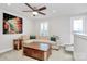 Cozy living room featuring a comfortable sectional sofa, unique coffee table, and a ceiling fan at 510 Music Hall Way, Charlotte, NC 28203