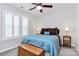 Bright main bedroom features neutral walls, plush carpet, ceiling fan, and large window with white shutters at 510 Music Hall Way, Charlotte, NC 28203