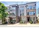 Exterior view of modern townhomes with brick and gray siding, showcasing their contemporary design at 510 Music Hall Way, Charlotte, NC 28203