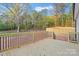 New deck with wooden railings offering beautiful views of the tree-lined backyard at 522 Waco Rd, Kings Mountain, NC 28086