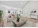 Open-concept living space with wood floors seamlessly flowing into the kitchen and dining area at 522 Waco Rd, Kings Mountain, NC 28086