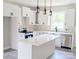Modern kitchen featuring white cabinets, an island, and stainless steel appliances at 524 Waco Rd, Kings Mountain, NC 28086