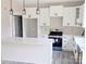 Contemporary kitchen with white cabinets, island, and stainless steel appliances at 524 Waco Rd, Kings Mountain, NC 28086