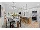 Open-concept kitchen and dining area with island seating and seamless flow to the living space at 524 Waco Rd, Kings Mountain, NC 28086