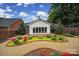 Well-maintained backyard featuring a garden area and gravel pathway leading to the house at 5404 Dunedin Ln, Charlotte, NC 28270