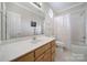 Bright bathroom with a large mirror, a tub-shower combination, and ample counter space at 5404 Dunedin Ln, Charlotte, NC 28270