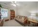 Cozy bedroom with neutral carpet, ceiling fan, and large window for natural light at 5404 Dunedin Ln, Charlotte, NC 28270