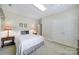 Bright bedroom features neutral walls, carpet, and a cozy bed, complemented by bedside tables and lamps at 5404 Dunedin Ln, Charlotte, NC 28270