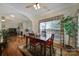 Open dining area with wood floors, archway view to the living room and plenty of natural light at 5404 Dunedin Ln, Charlotte, NC 28270