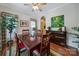 Spacious dining area featuring a wood table, decorative plants, and warm lighting at 5404 Dunedin Ln, Charlotte, NC 28270