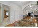 Hallway leading into living room with hardwood floors and neutral paint at 5404 Dunedin Ln, Charlotte, NC 28270