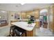 Eat-in kitchen features wooden cabinets, an island, and stainless steel appliances at 5404 Dunedin Ln, Charlotte, NC 28270