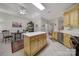Bright kitchen features wooden cabinets, stainless steel appliances, and a kitchen island at 5404 Dunedin Ln, Charlotte, NC 28270