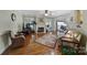 Inviting living room featuring hardwood floors, a fireplace, and a ceiling fan at 5404 Dunedin Ln, Charlotte, NC 28270