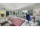 Bright sunroom with lots of windows, comfortable seating, and natural light at 5404 Dunedin Ln, Charlotte, NC 28270