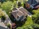 Aerial view of a home with a large backyard, deck, well-maintained lawn, and mature trees at 551 Hemmings Nw Pl, Concord, NC 28027