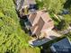 Aerial shot of a property with a lush backyard, landscaping, hardscape, and a well-maintained lawn at 551 Hemmings Nw Pl, Concord, NC 28027