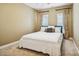 Serene bedroom with neutral colors, ample natural light, and cozy carpet at 551 Hemmings Nw Pl, Concord, NC 28027